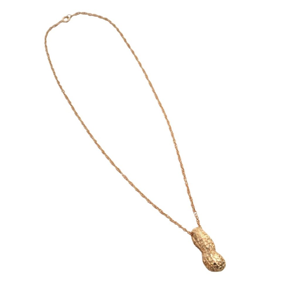 Gold tone peanut pendant necklace
